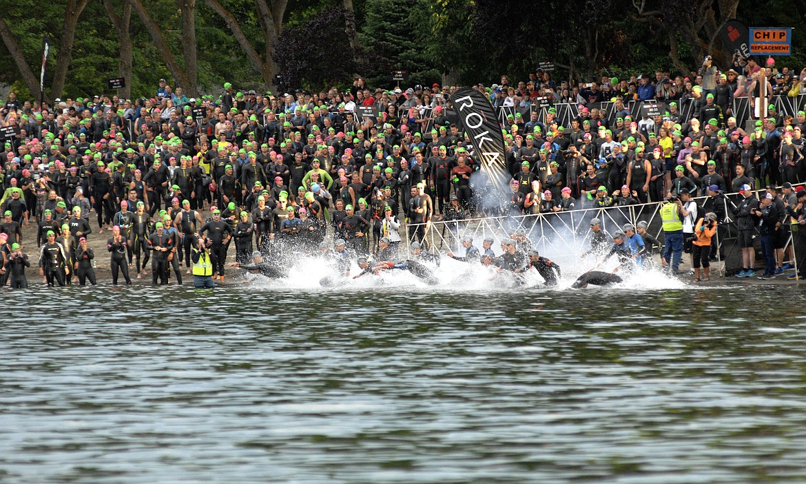 JIM MOWREADER/Press
Professional men athletes start their swim during Ironman 70.3 Coeur d&#146;Alene on Sunday.