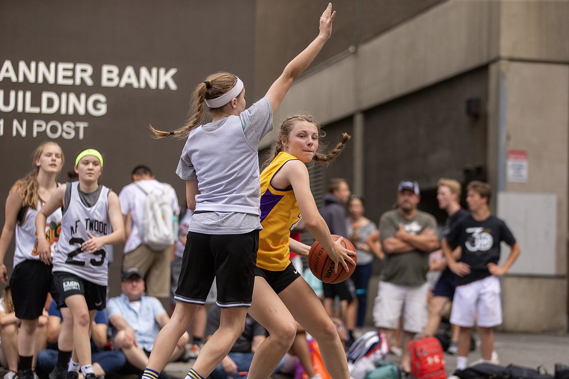 (Photo courtesy of JASON DUCHOW PHOTOGRAPHY)
Sandpoint junior Kaylee Banks looks to pass around her defender at 2019 Hoopfest, held in Spokane from June 29-30. The Sandpoint Glam Slams, which featured Banks and her Sandpoint High School teammates Dawson Driggs, Izzo Edwards and Brooklen Steiger, finished 2-2 in their high school girls&#146; bracket.