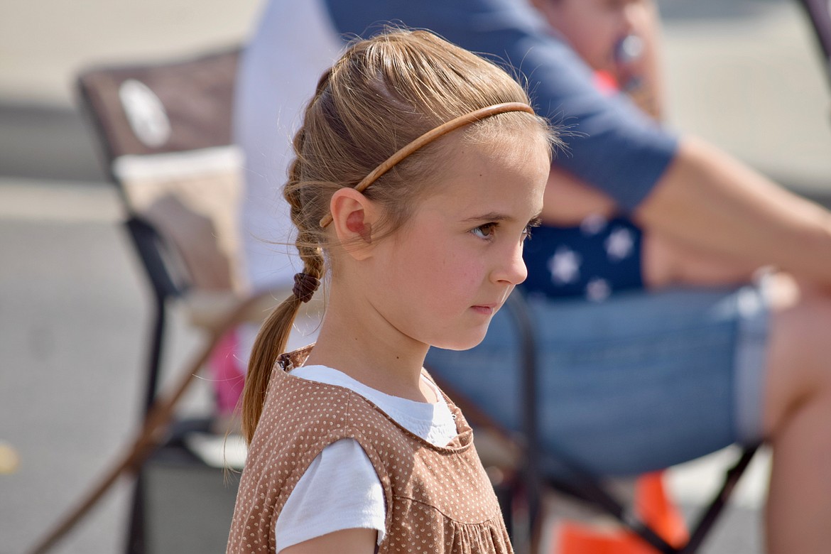 Charles H. Featherstone/Sun Tribune
A young girl eagerly awaits candy to be thrown her way during the parade.