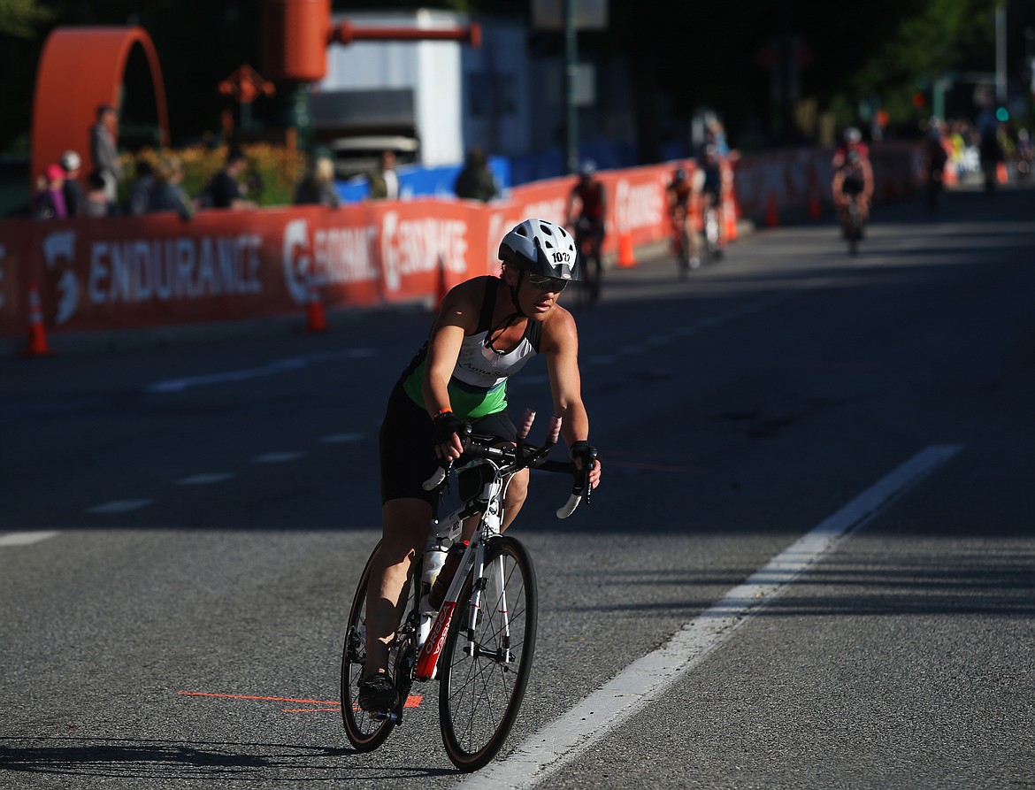 LOREN BENOIT/Press
Chelsea Pearson, of Post Falls, makes her way around a turn at Northwest Boulevard and East Lakeside Avenue during Ironman 70.3 Coeur d&#146;Alene. Pearson finished with a time of 6 hours, 20 minutes and 2 seconds.