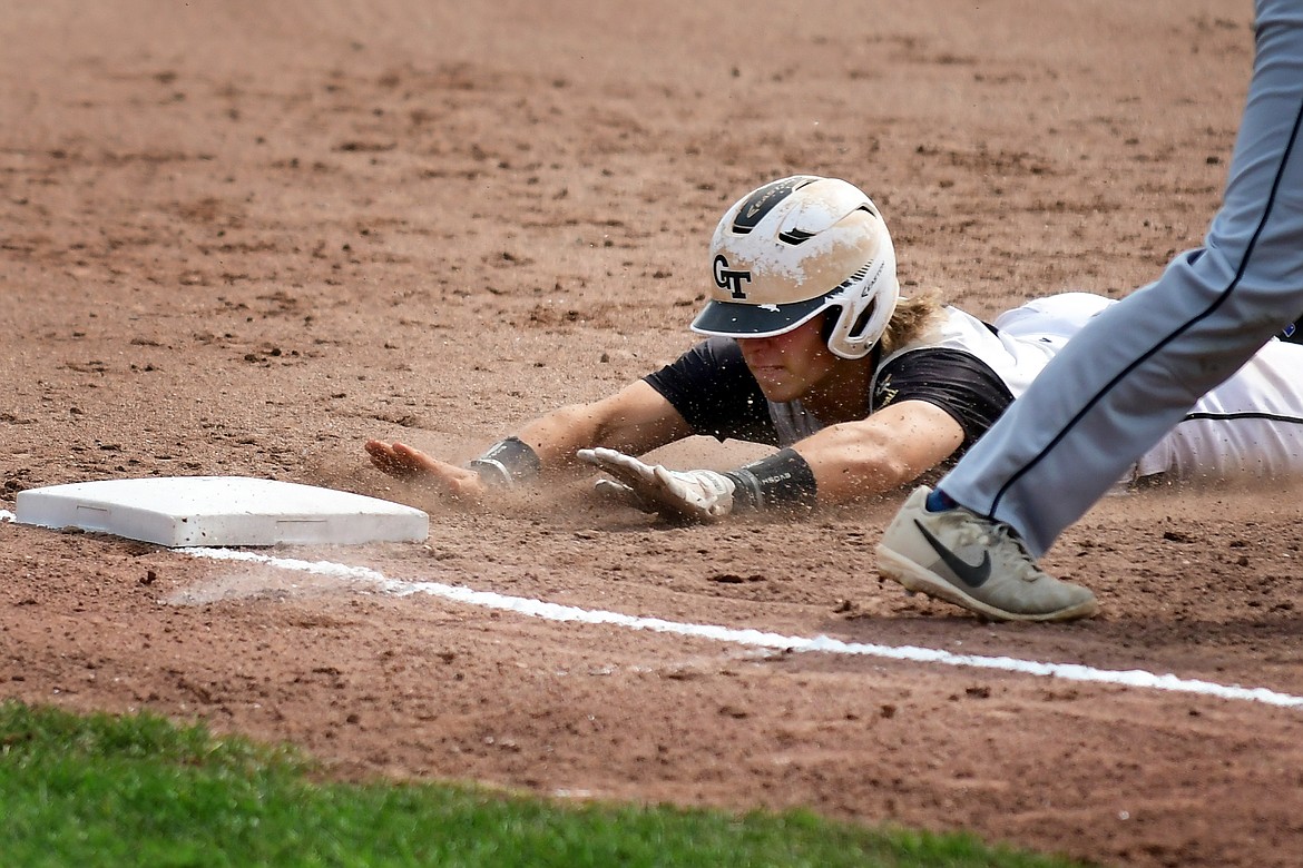 Zach Veneman slides safely into third in the first inning of the Glacier Twins game against the Missoula Mavericks last week at Memorial Field. (Jeremy Weber/Hungry Horse News)