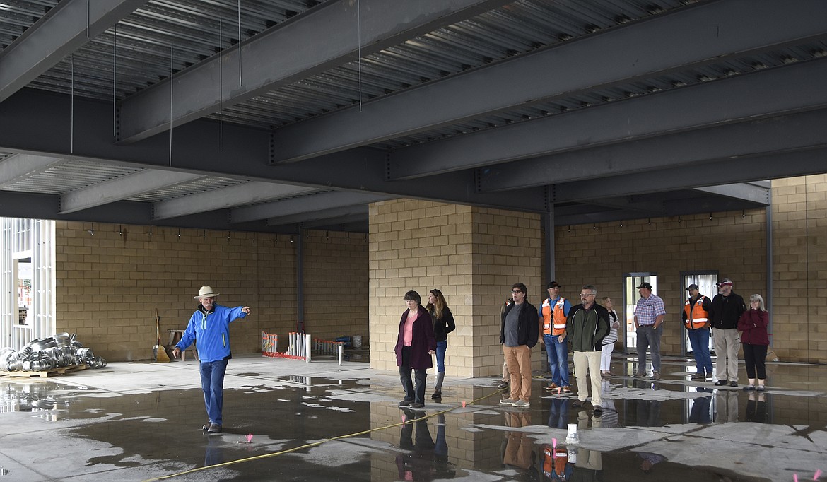 Owner&#146;s representative Dow Powell walks trustees through the main corridor that will connect the cafeteria and gym to the first and second grade wings during a tour of the new Muldown school. (Daniel McKay/Whitefish Pilot)