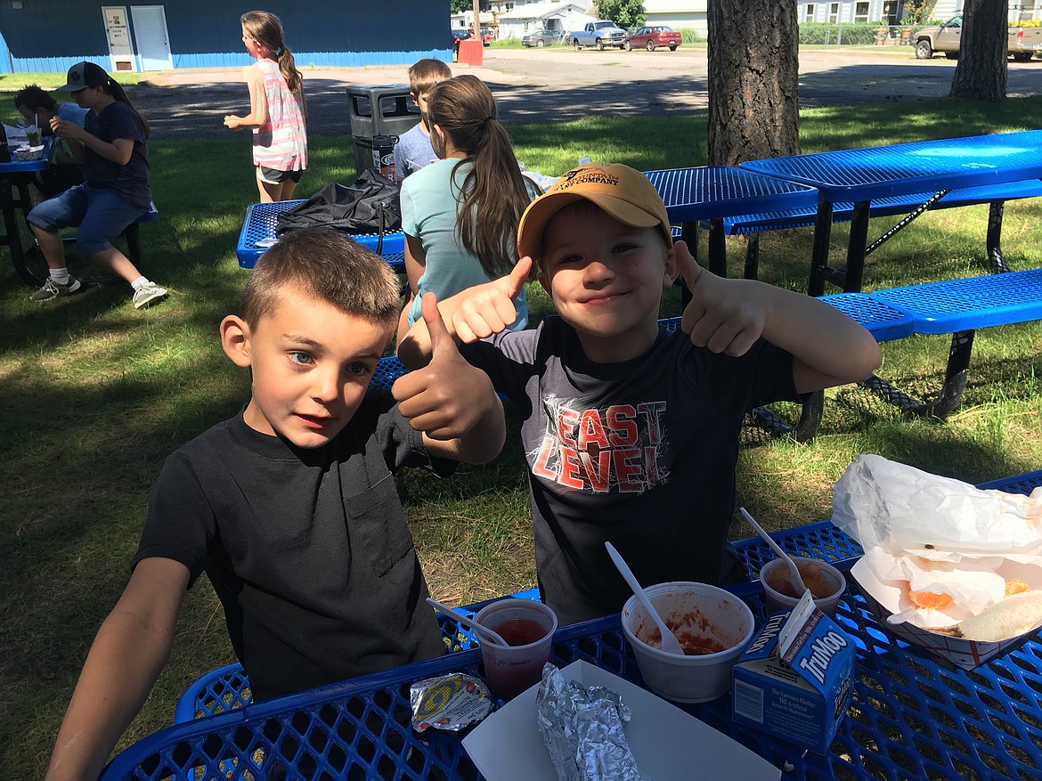 Superior Elementary students Mason Rogers and Eli Labbe enjoy free lunch during the summer camp. (Courtesy photo)