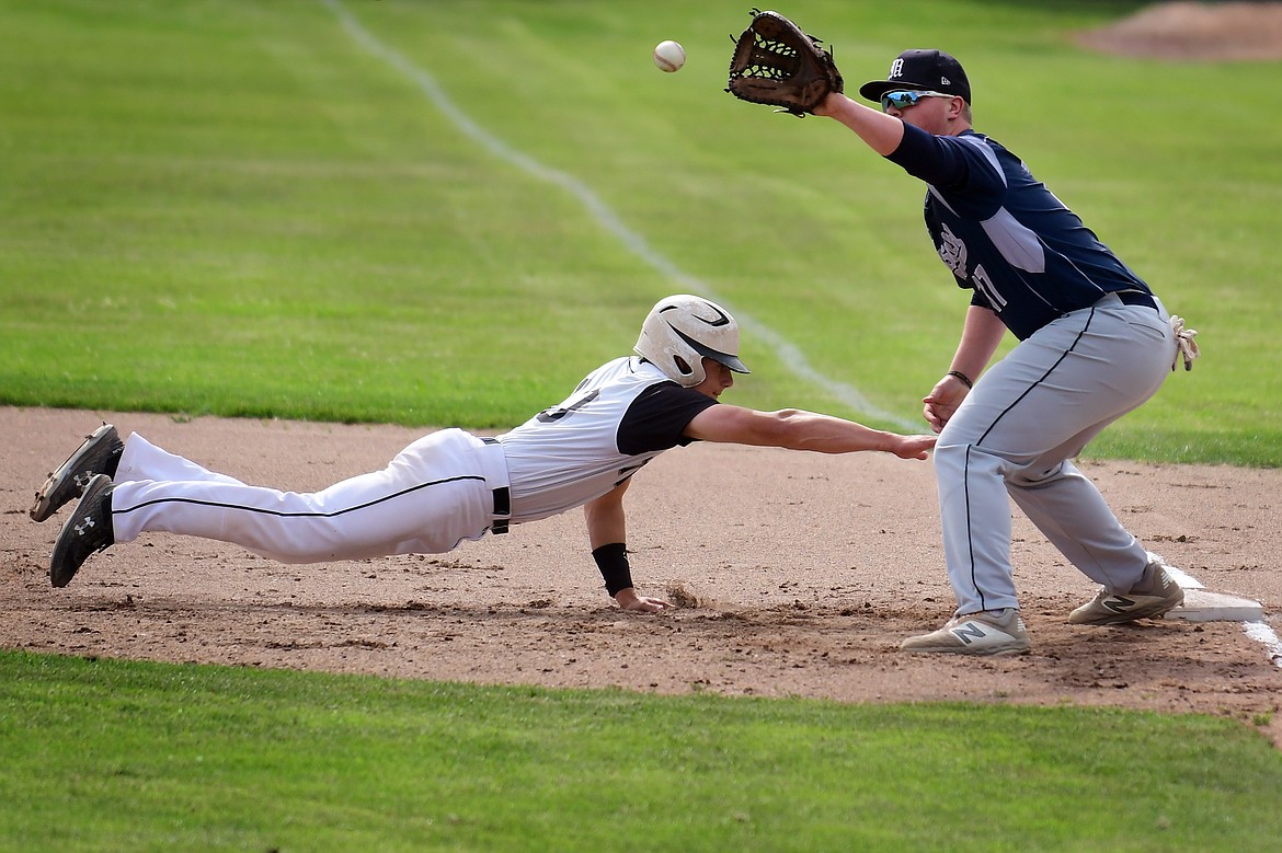 Coby Clark-Dickinson beats the pickoff throw back to first base in the opening inning