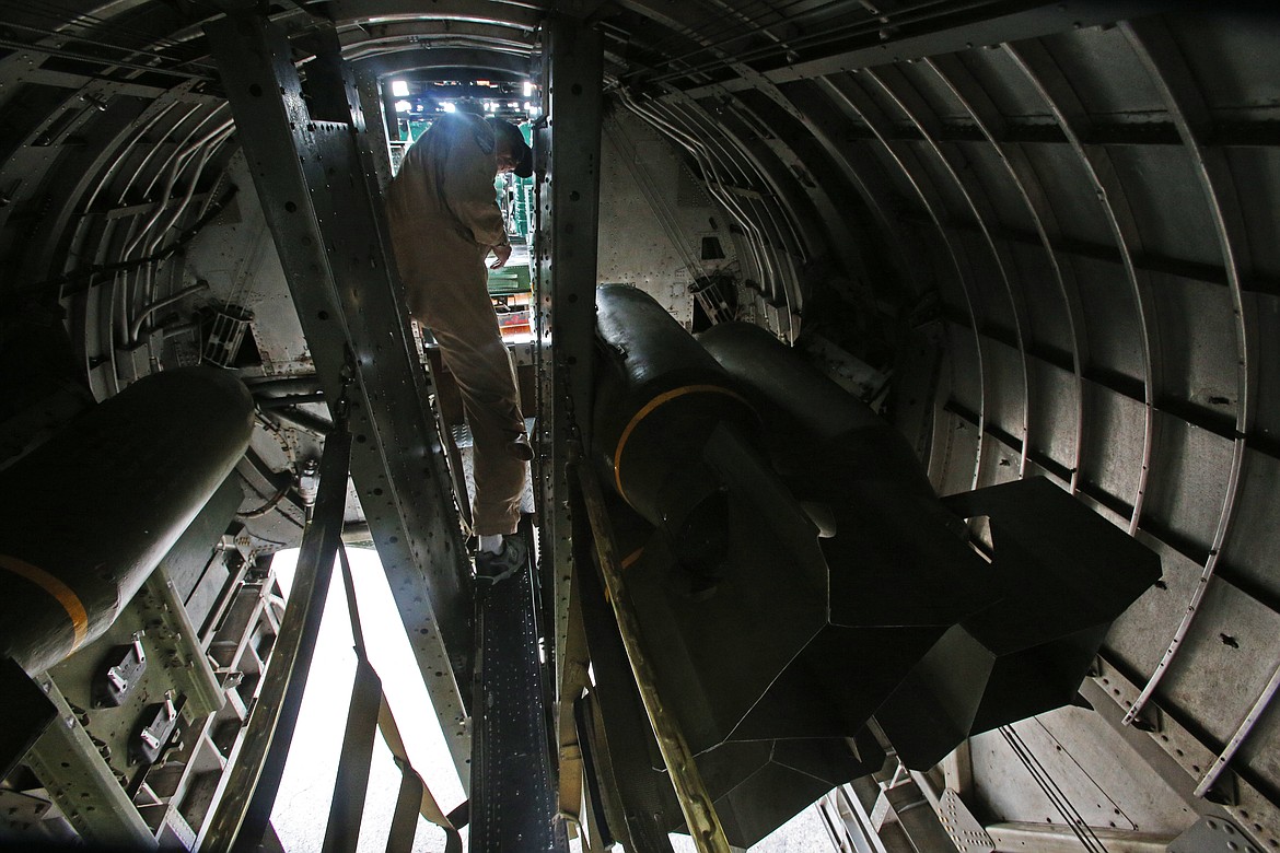 &quot;Sentimental Journey&quot; crew member Bill Croutch walks through the bomb bay to the cockpit. The plane can carry around 8000 pound bomb payload. (LOREN BENOIT/Press)