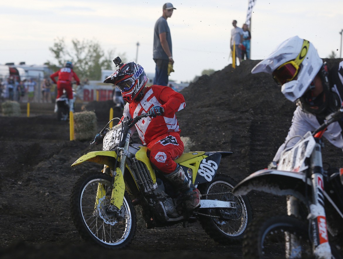 Kolton Pollinsky approaches a turn in the beginning of the 250 Pro arenaross race Friday night at the Kootenai County Fairgrounds.