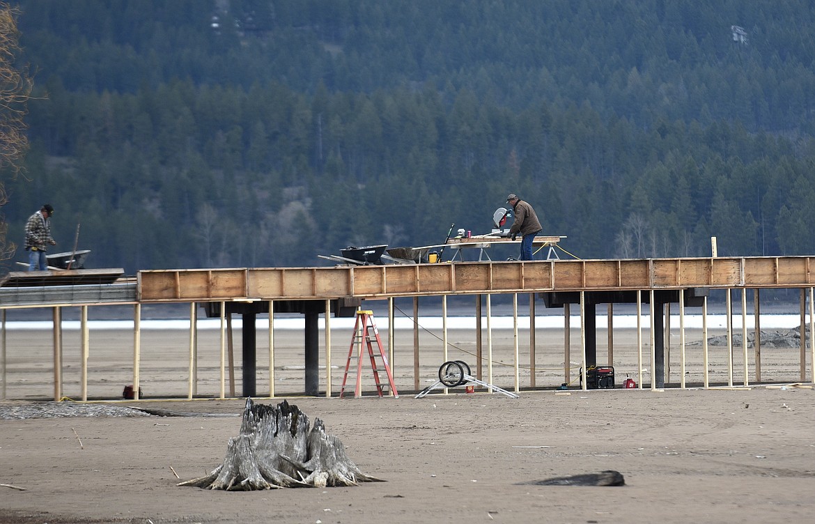 A construction crew works on Dockstader Island Bridge in Bigfork on Monday. (Aaric Bryan/Daily Inter Lake)