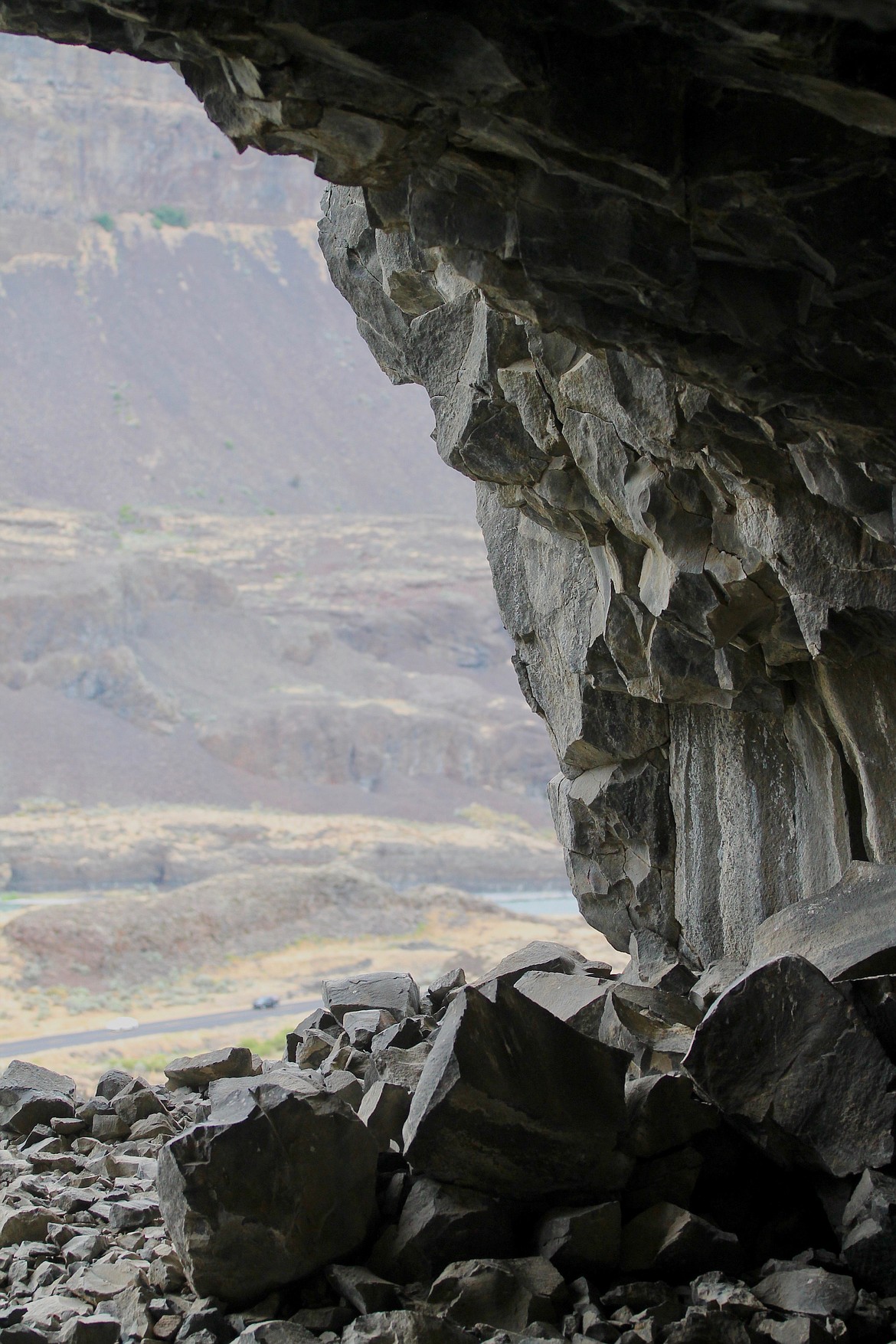 Casey McCarthy/ Columbia Basin Herald  A view from inside of the caves above Lake Lenore looking out over the canyon below.