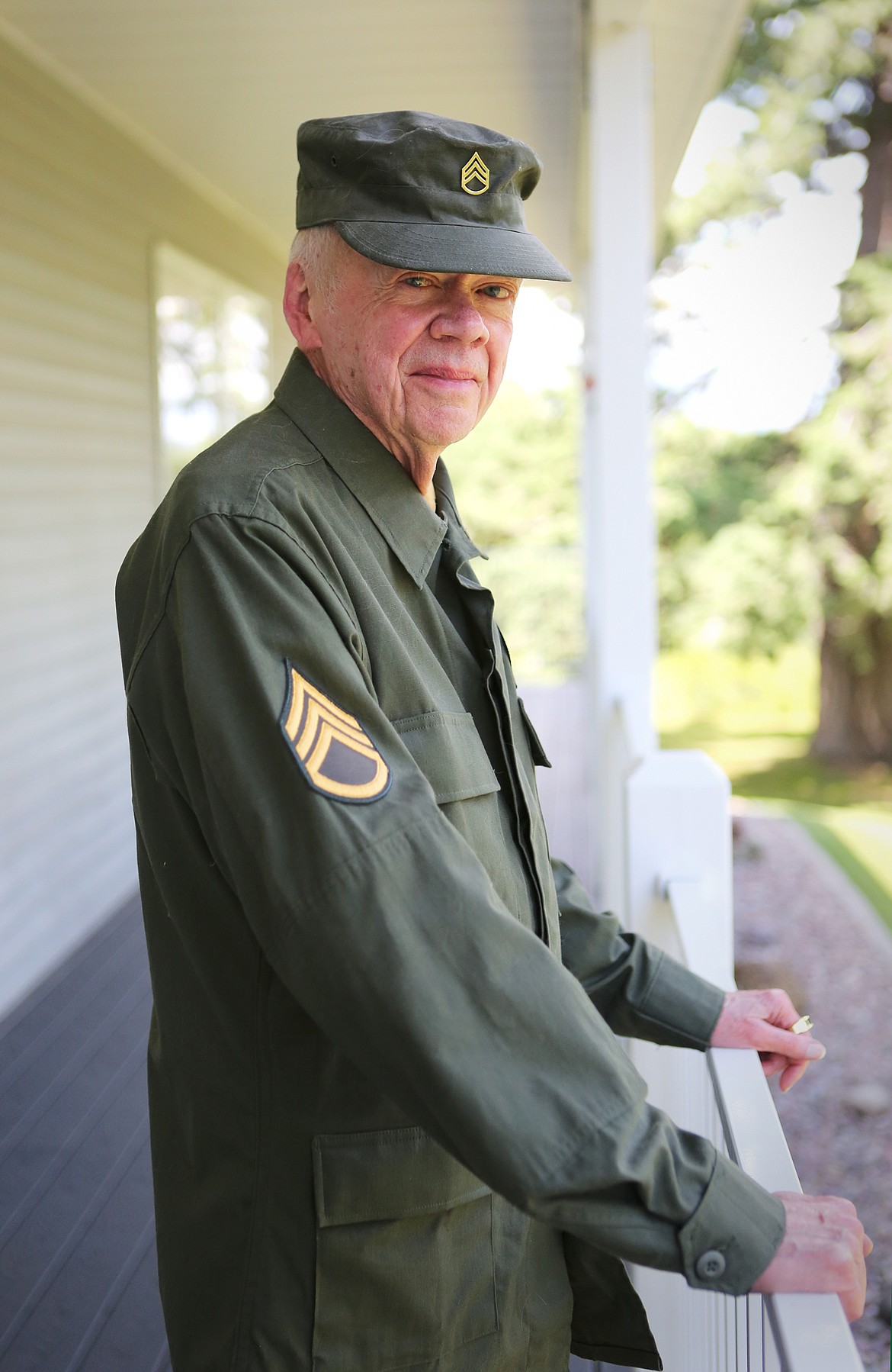 Frank Tumbelty at his home in Kalispell wearing his Army uniform. (Mackenzie Reiss/Daily Inter Lake)