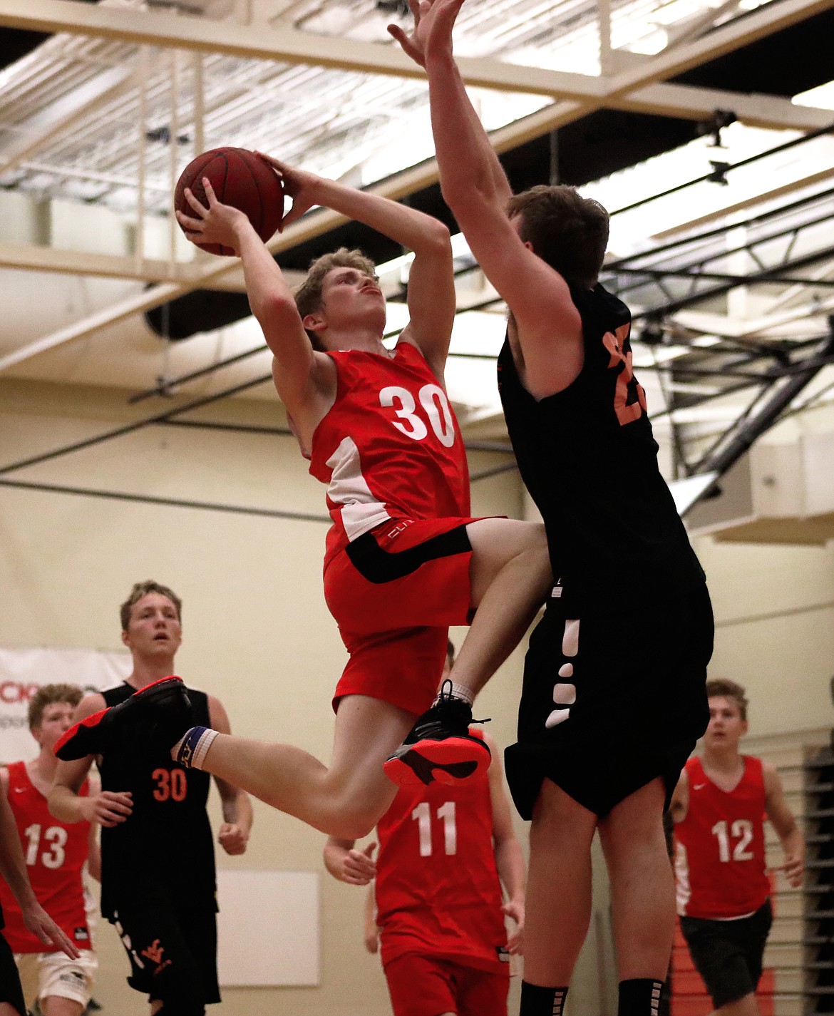 (Photo by KYLE CAJERO)
Sandpoint senior point guard Kobe Banks soars for a contested layup against West Valley on July 10.