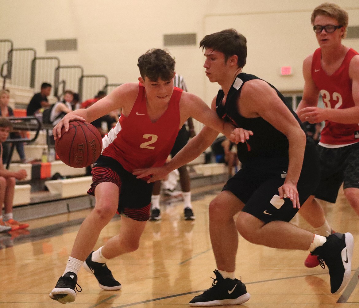 (Photo by KYLE CAJERO)
Sandpoint freshman Arie VanDenBerg draws contact from a West Valley defender on July 10.