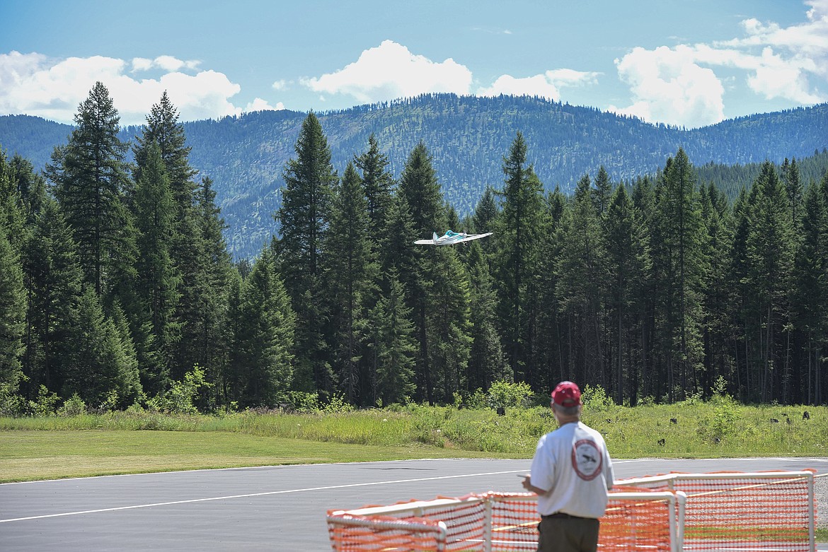 Ron Anderson flies his radio-controlled plane from the pilots area, Saturday at the Kootenai RC Flyers Fun Fly. (Ben Kibbey/The Western News)