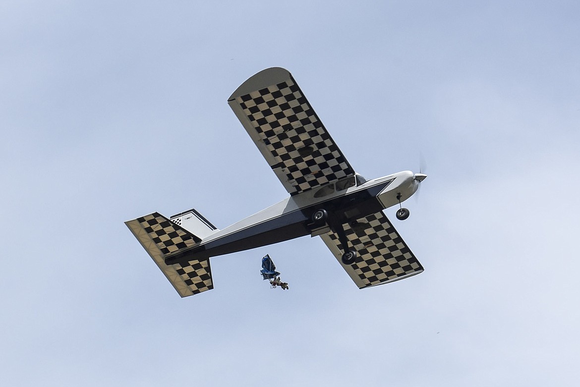 The bay doors open and the parachutist falls from Ron Anderson&#146;s radio controlled plane, Saturday at the Kootenai RC Flyers Fun Fly. (Ben Kibbey/The Western News)