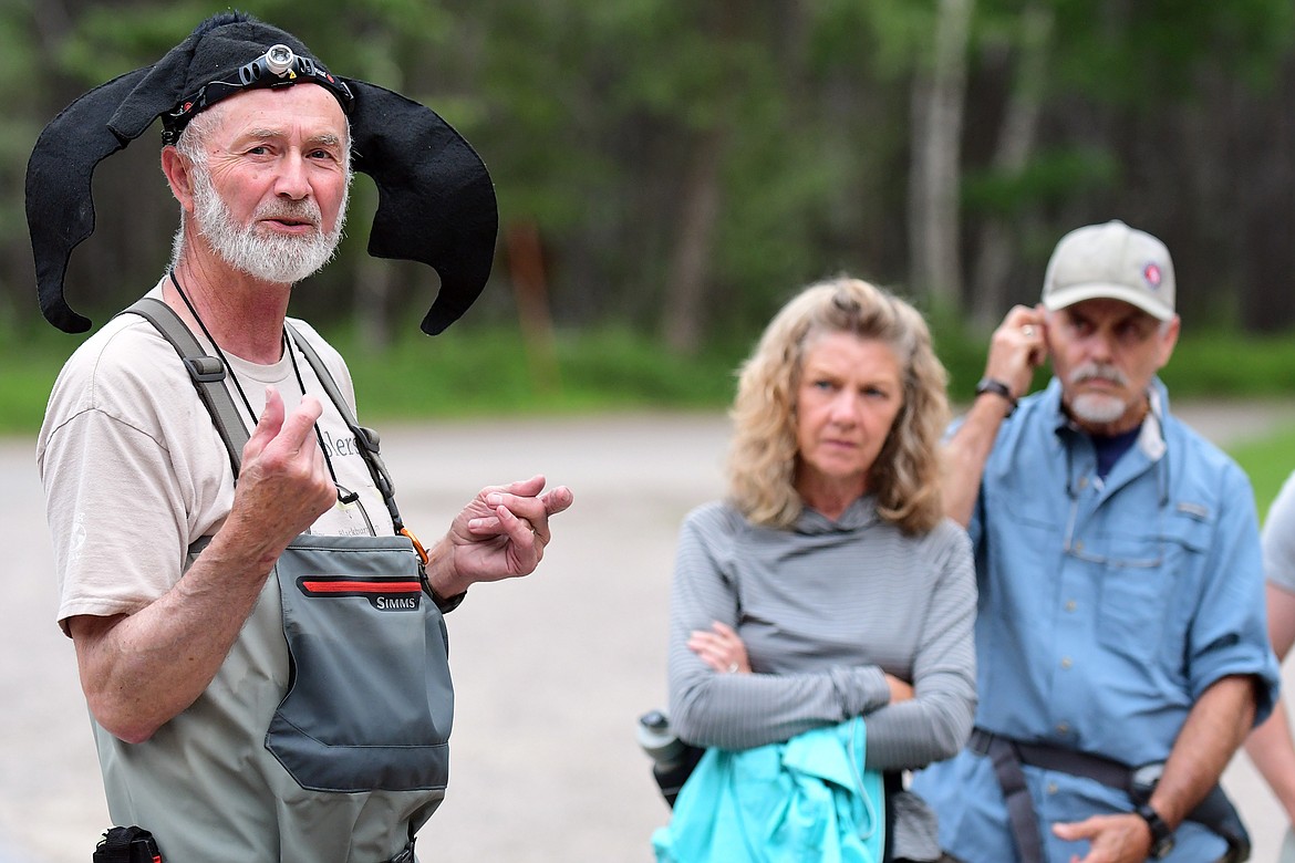 Lewis Young, a retired biologist from the U.S. Forest Service, shows his appreciation of bats while he talks about them during a Glacier National Park program on the winged mammals Wednesday. (Jeremy Weber/Hungry Horse News)