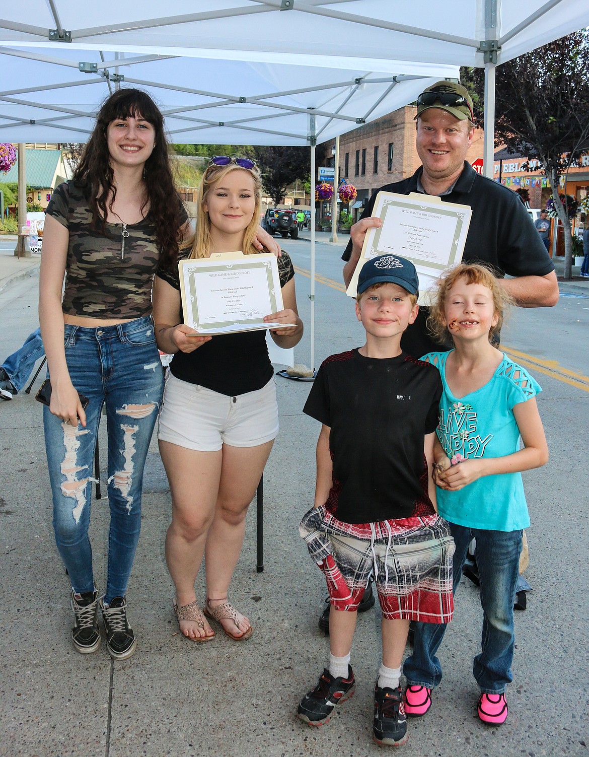 From left: Micah Shure, Anneli Skilton and Dave Allen. Also, 8-year-old twins, Cole and Constance Allen, wearing evidence of tasting the competitor&#146;s food.