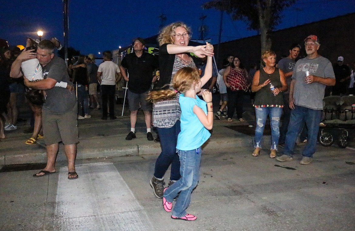 Photo by MANDI BATEMAN
Lori Allen dancing with her daughter at the street dance.