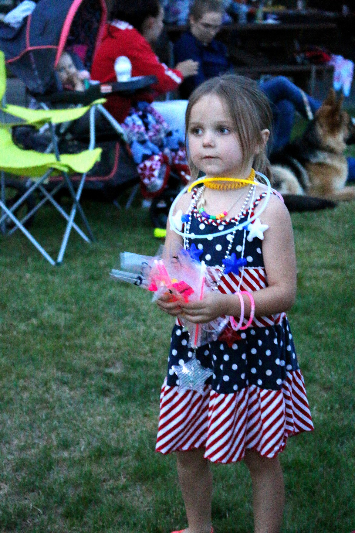 (Photo by MARY MALONE)
As the sun set over Bonner Park West on the Fourth of July, a youngster set out to sell items such as glow sticks to the crowd gathering for the Priest River Chamber of Commerce&#146;s annual fireworks show.