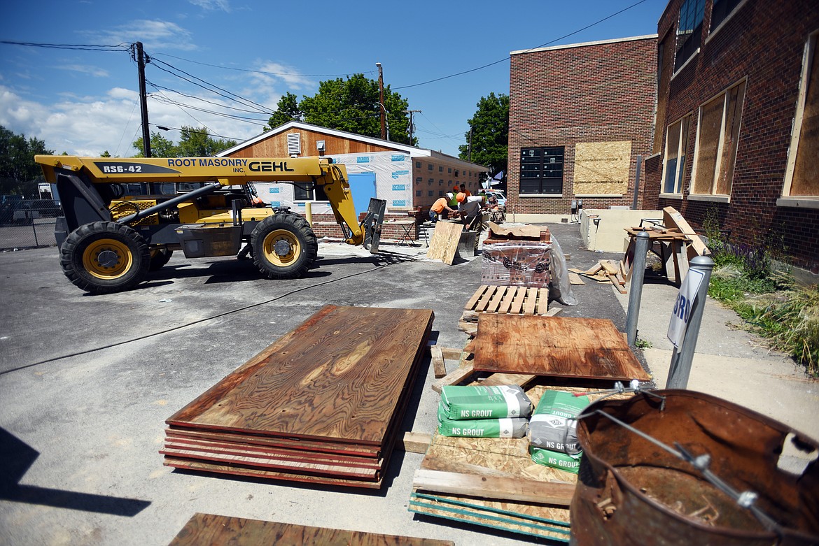 The crew from Swank work on Linderman Education Center on Tuesday, July 9. Most of the work will be done in the fall. (Brenda Ahearn/Daily Inter Lake)