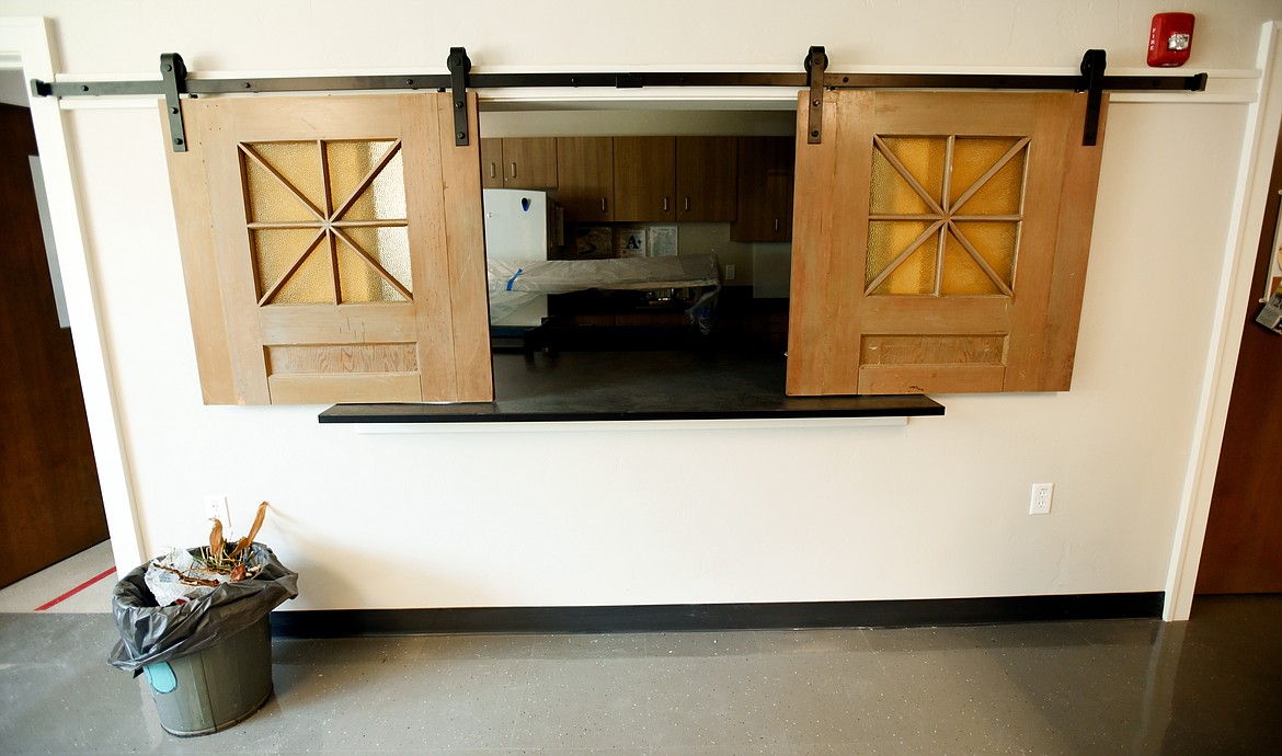 Old doors on a portion of the Linderman Education Center building that originally served as a church, were preserved and transformed into sliding doors for the cafeteria. The basement of the building was remodeled into the cafeteria, which was previously held on the gym stage. (Brenda Ahearn/Daily Inter Lake)