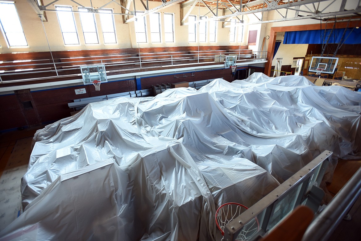 furniture?and supplies the school uses have been packed into the gymnasium and covered under protective plastic as construction takes place at Linderman on Tuesday, July 9, in Kalispell. (Brenda Ahearn/Daily Inter Lake)