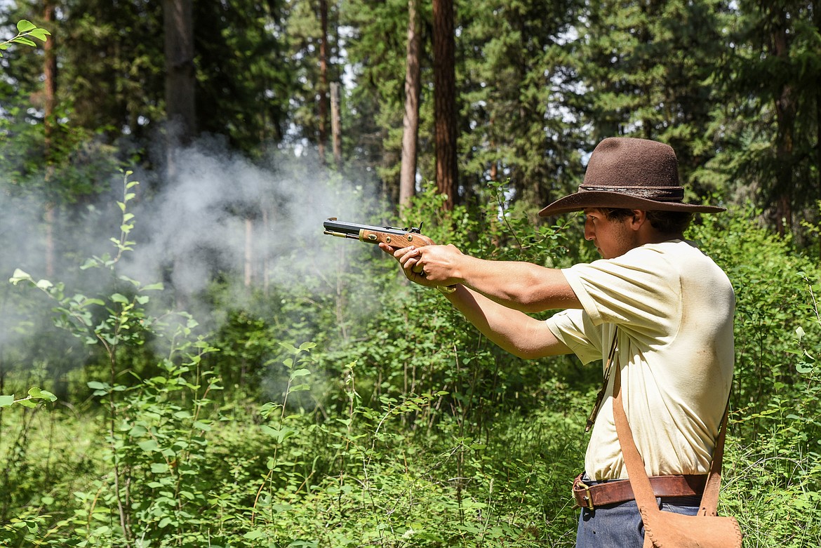 Joshua Keim fires his black powder pistol at the Two Rivers Rendezvous Saturday. (Ben Kibbey/The Western News)