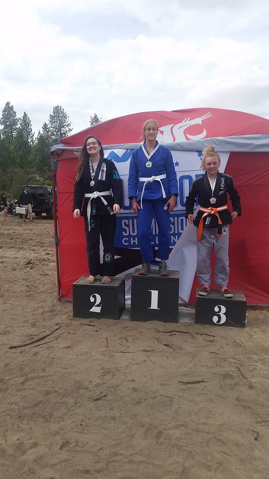 Above: Shahanna Bushnell posing on the podium.

Left: Shahannah Bushnell attended a Jui-Jitsu competition and won second place.
Courtesy photos