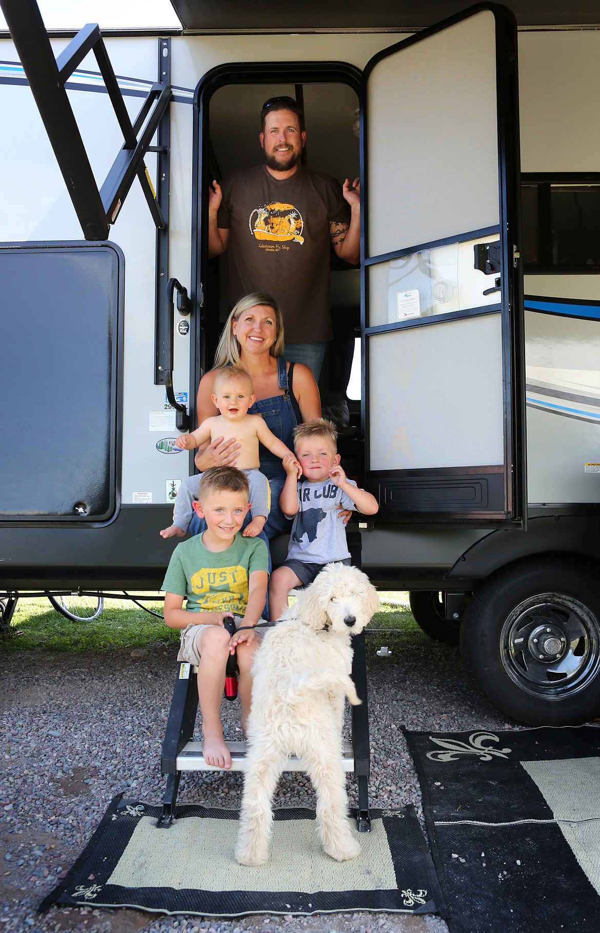 Travis Walton, his wife Lauren, and sons Jameson, 8 months, Grayson, 3, and Jackson, 7, and goldendoodle, Charlie, at Mountain View RV Park in Columbia Falls.