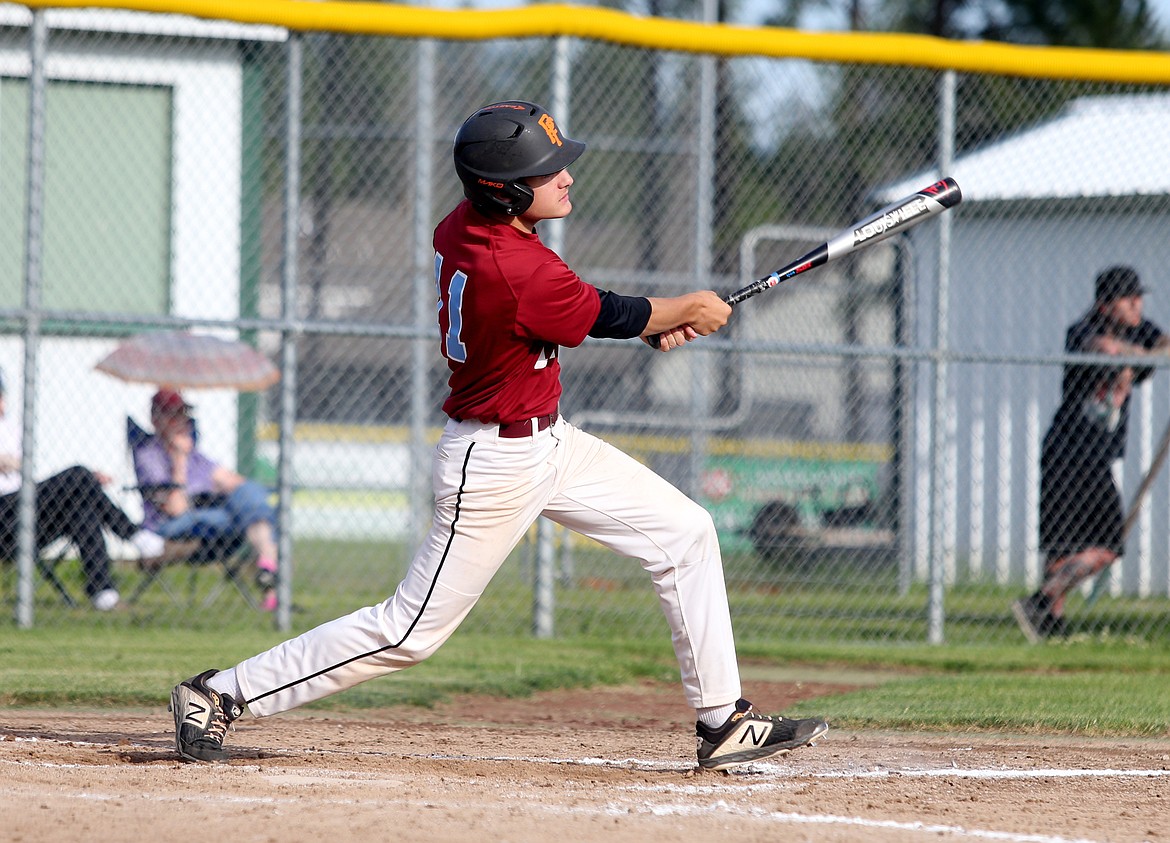 Prairie Cardinal Ethan Miller makes contact on a pitch for a line drive in a game against the Northern Lakes Mountaineers on Tuesday in Rathdrum. (LOREN BENOIT/Press)