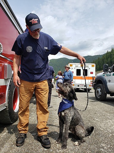 Photo by SANDY STEINHAGEN
Hall Mountain Firefighter Andy Durette and this dog, Puppers, at the Eastport Fourth of July parade.