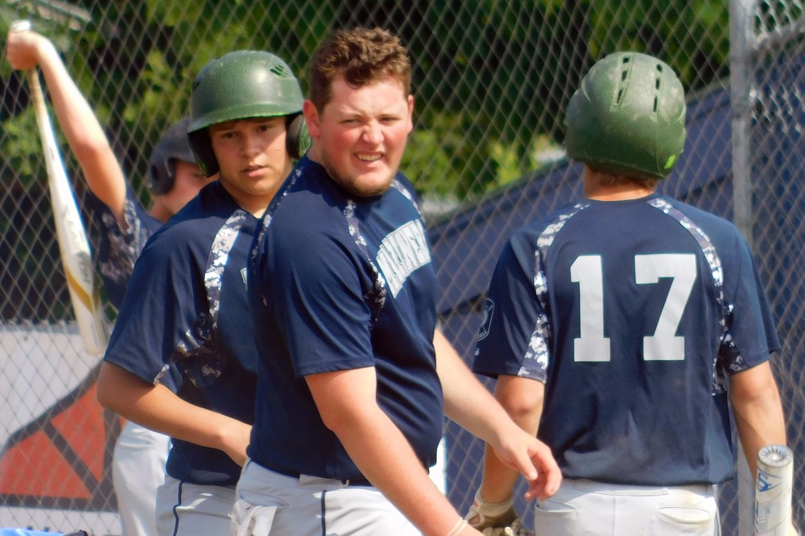 MISSION VALLEY Mariners baseball player Corbin Davis celebrates with his teammates after scoring a run during a Mission Valley Mariners regular-season baseball game. (Photo courtesy of Erin Bennett)