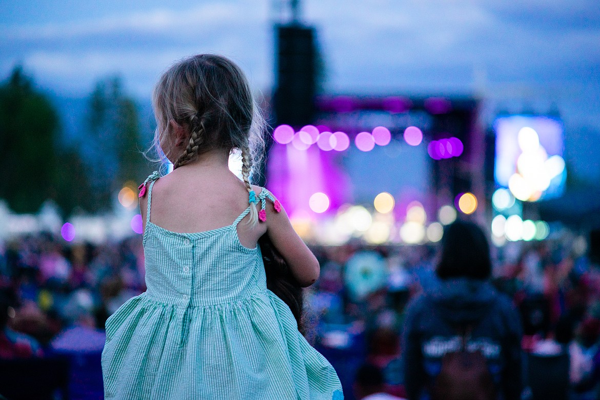 A young concert-goer gets a lift during the Under the Big Sky music festival over the weekend at Big Mountain Ranch east of Whitefish. (Daniel McKay/Whitefish Pilot)