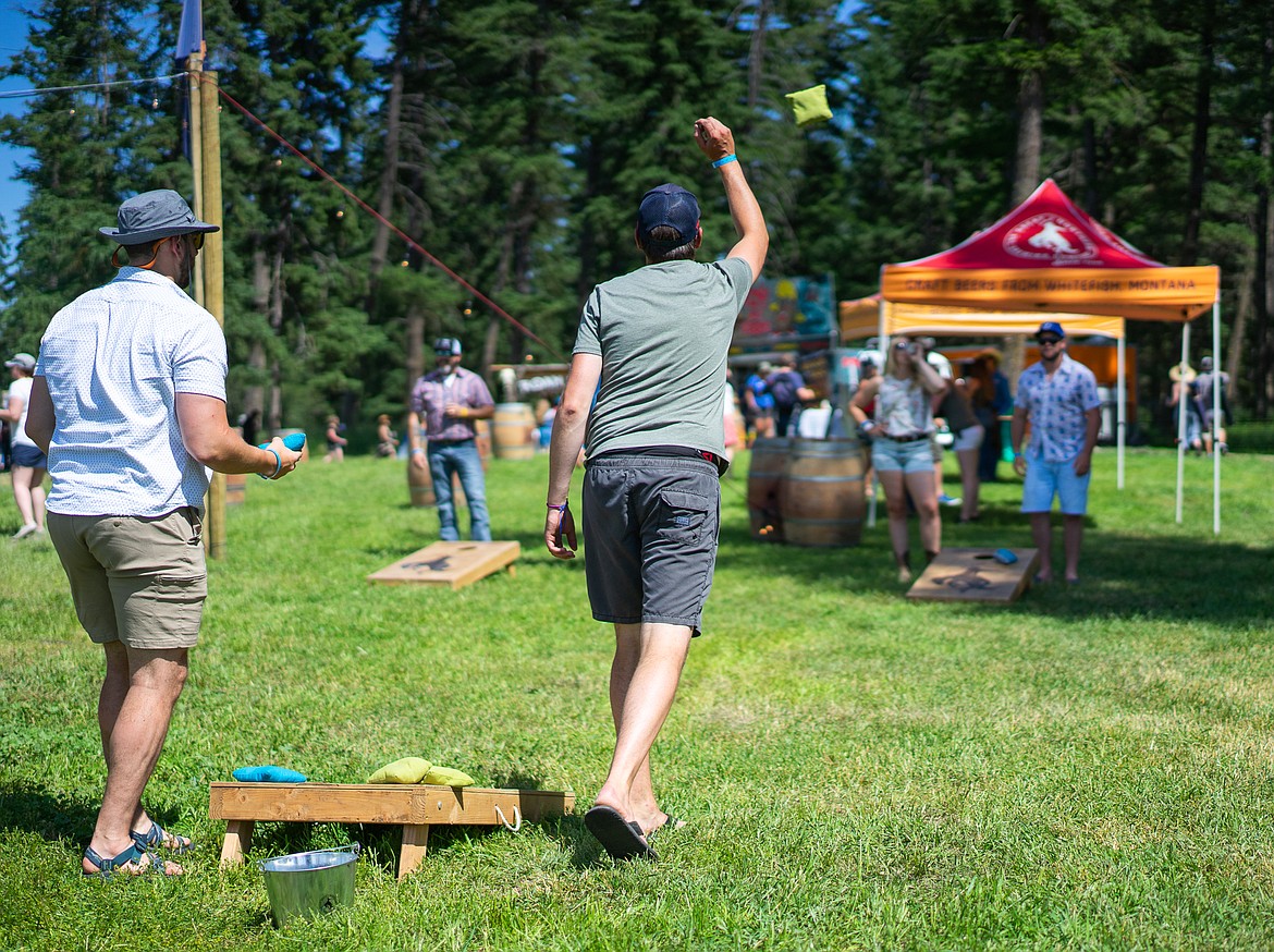 Some friends enjoy bag toss during the Under the Big Sky music festival over the weekend at Big Mountain Ranch east of Whitefish. (Daniel McKay/Whitefish Pilot)