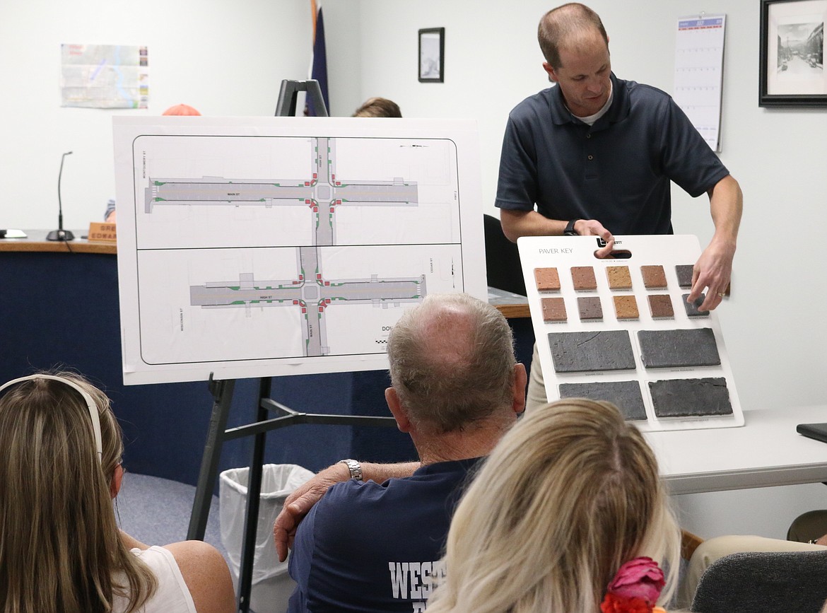 (Photo by MARY MALONE)
Welch Comer Engineer Matt Gillis shows the options of clay pavers for Priest River&#146;s downtown revitalization project to group of community members who attended Tuesday&#146;s public meeting regarding the construction schedule.