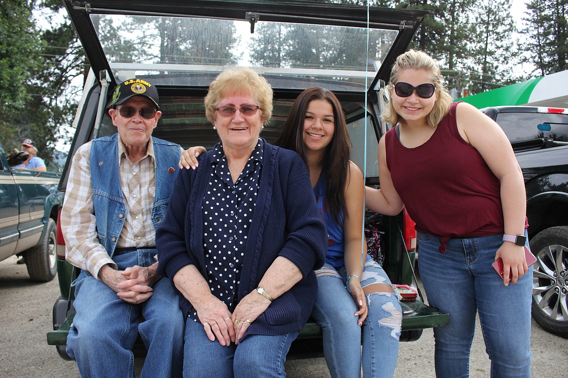 U.S. Army veteran Jay Smith waits for the parade to start with his wife, Nancy Smith, and his granddaughers Kaydence and Krystina Thompson. (Maggie Dresser/Mineral Independent)