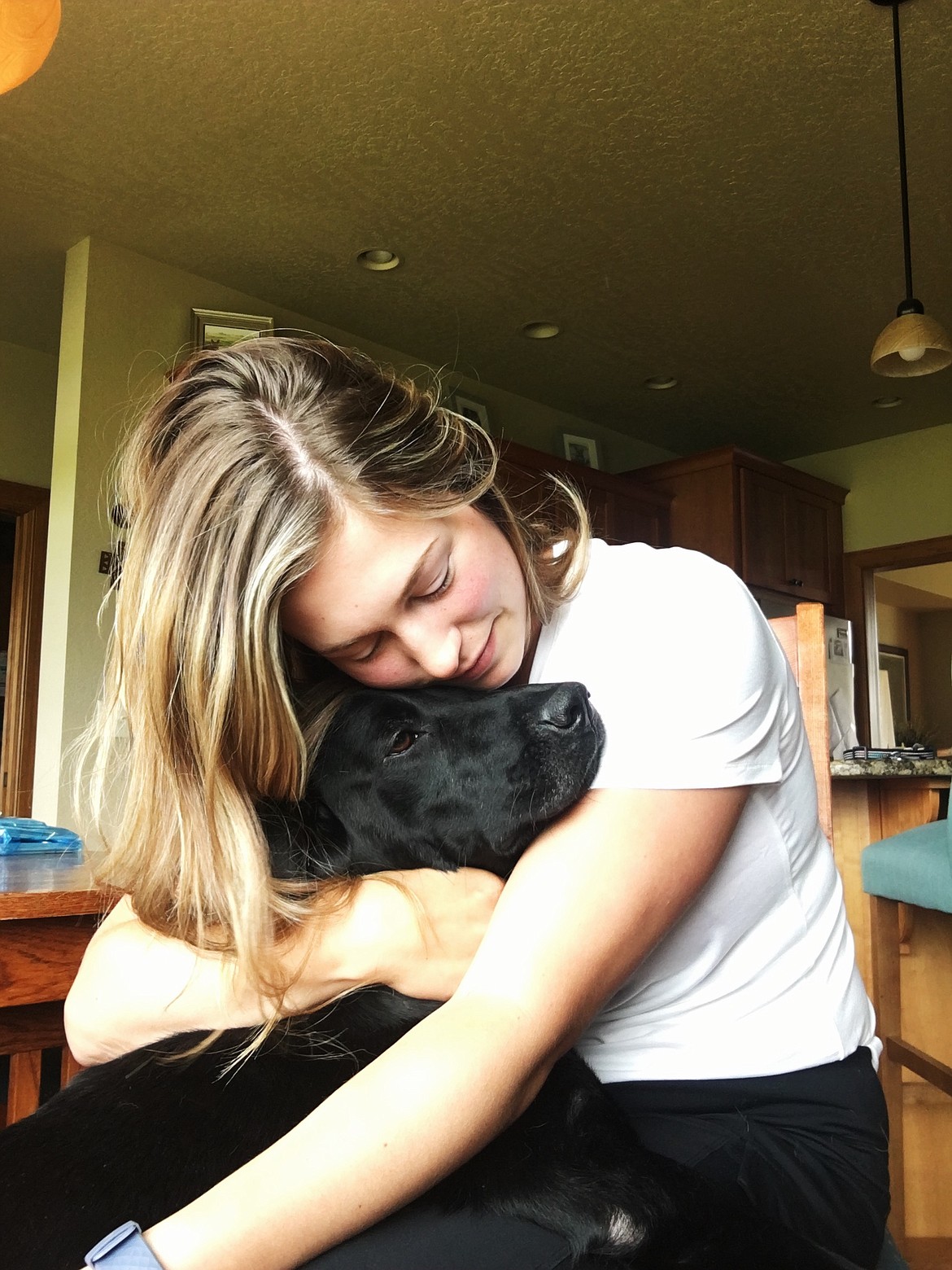 ERIKA SPAULDING was reunited with her dog, Onyx, after he was allegedly stolen in Missoula, Sunday, June 7. The dog was let out at a gas station in Ronan prior to a high-speed chase by law enforcement. (Courtesy photo)