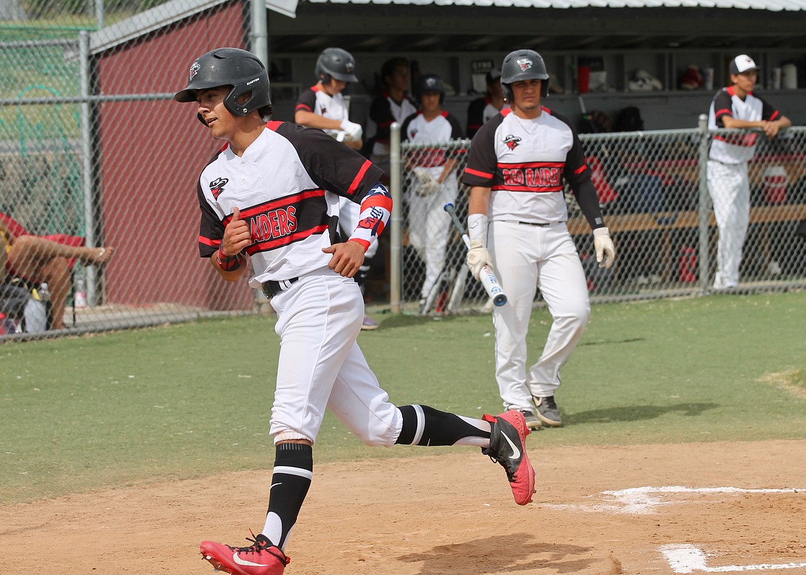 Casey McCarthy/Sun Tribune
Nathan Garza Jr. crosses the plate to score to make it 2-0 in the bottom of the first inning for the Red Raiders.