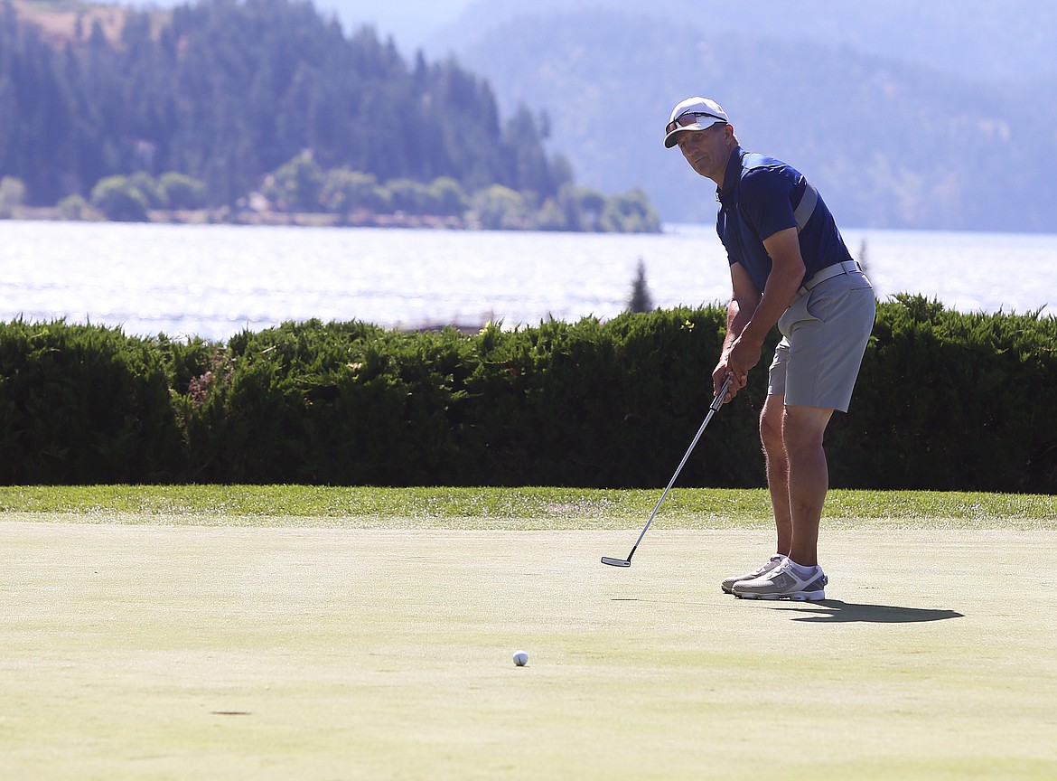 Former professional hockey player and future Hockey Hall of Fame inductee Guy Carbonneau watches his putt during the Showcase celebrity golf exhibition Saturday at The Coeur d&#146;Alene Resort Golf Course.