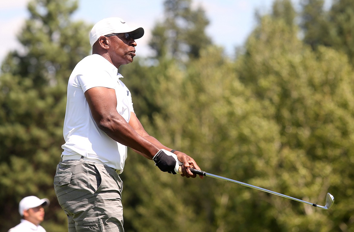 Six-time NFL Pro Bowler and former running back Eric Dickerson watches one of his tee shots during the Showcase celebrity golf exhibition.