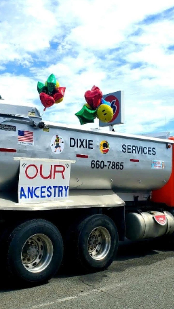 A Dixie Services dump truck decorated for Coeur d'Alene's Fourth of July parade. Images depicting watermelon are attached to its hull, and balloons mimicking watermelon stem from its top. (Courtesy of Jim Valentine)