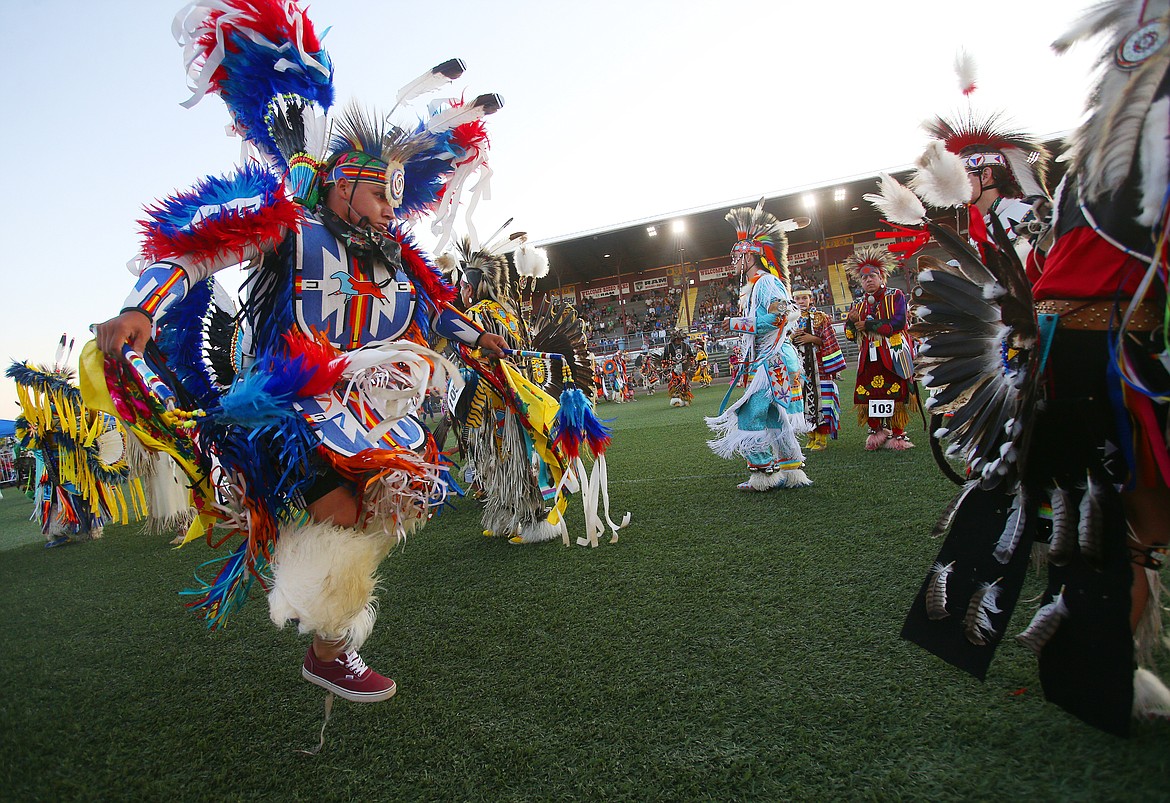 Darian Brown, of the Dakota Tribe, dances in his traditional regalia during the Julyamsh Grand Entry Friday night at the Kootenai County Fairgrounds. Around 300 dancers from the United States and Canada are at this year&#146;s Julyamsh. (LOREN BENOIT/Press)