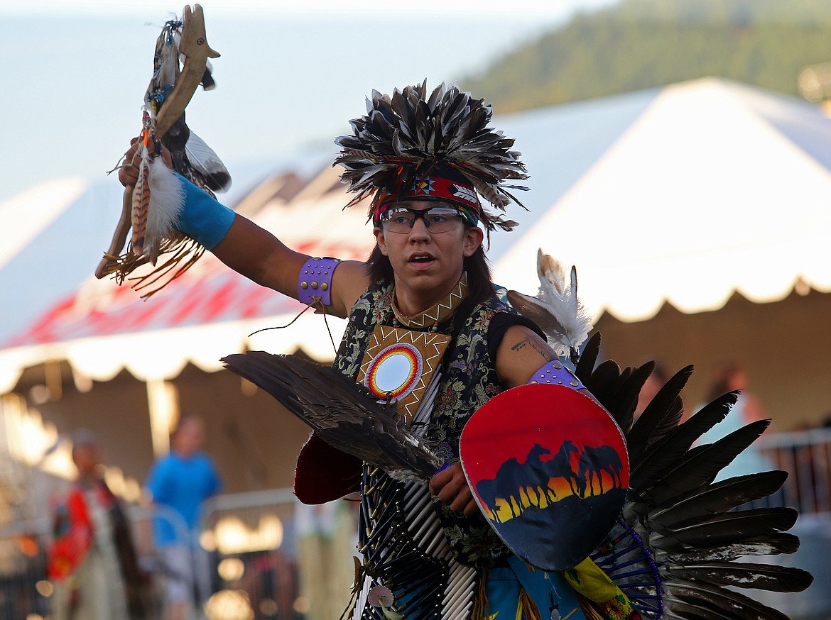 Nathan Fulton, of the Coeur d&#146;Alene Tribe, dances in the Julyamsh grand entry Friday night at the Kootenai County Fairgrounds. (LOREN BENOIT/Press)