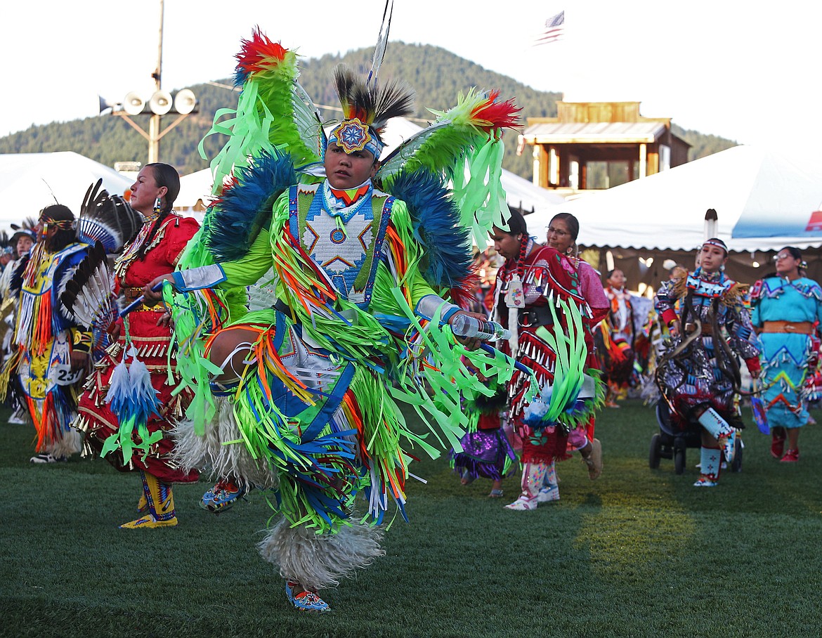 Dasan Schoolfield, of the Potawatomi Tribe in Kansas, dances in the Julyamsh Grand Entry Friday night at the Kootenai County Fairgrounds. (LOREN BENOIT/Press)