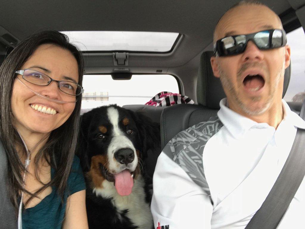 Jen and Corey McKenna, with their pup Samson, are headed out for a car trip in fall 2017. Jen did not survive complications from her double-lung transplant and her life will be celebrated Aug. 17 at Coeur d'Alene Bible Church. (Courtesy photo)