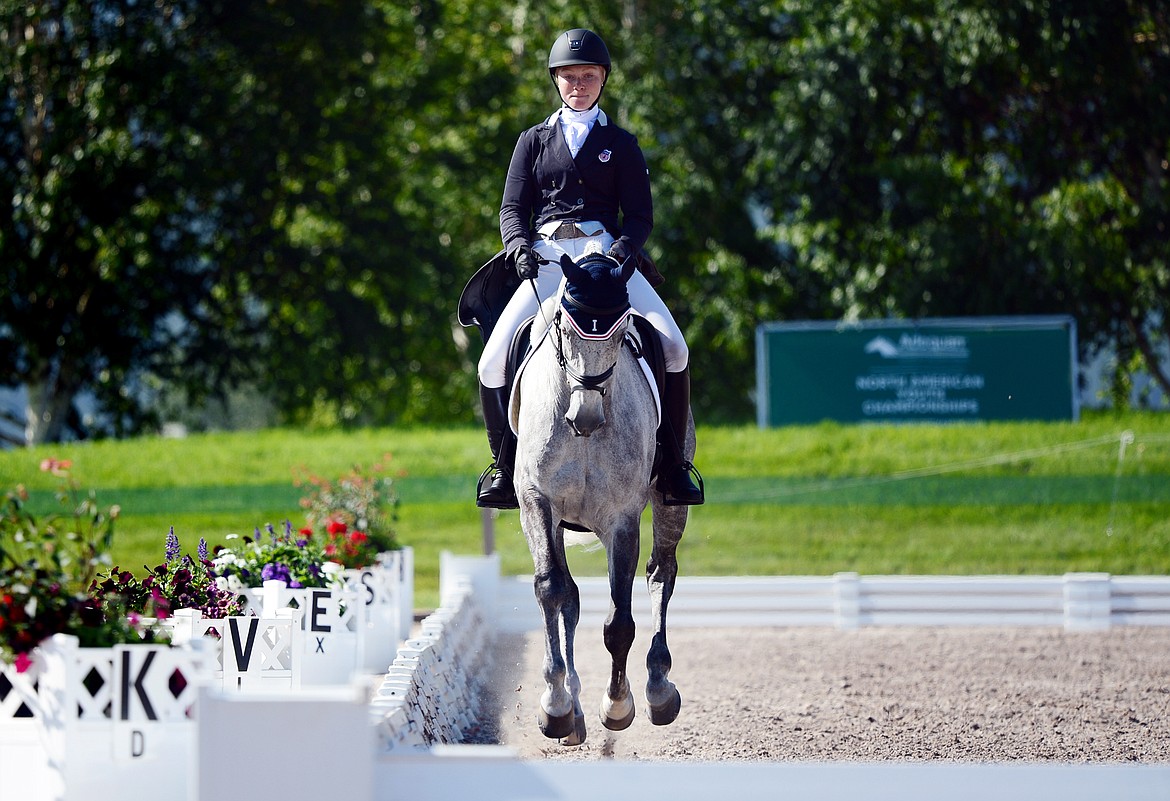 Katie Lichten rides Sapphire Blue B in the CCIY3*-S dressage division at The Event at Rebecca Farm on Thursday. (Casey Kreider/Daily Inter Lake)