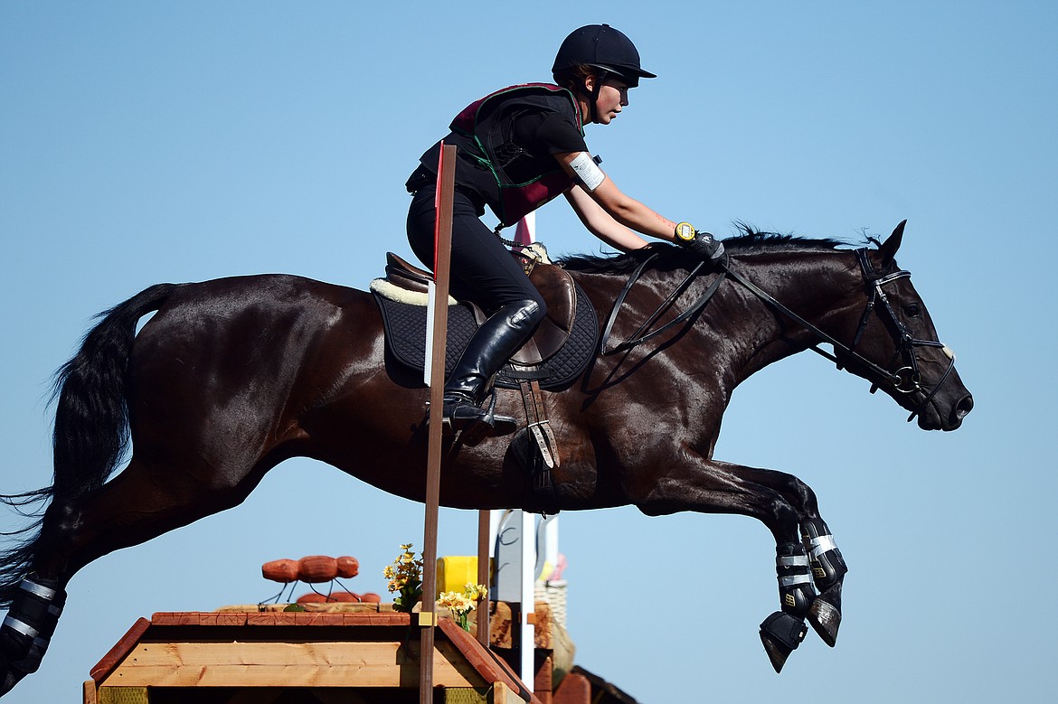 Katie Youngblood-Besel rides TBF Sweet Malachai in the Senior Open Novice E cross-country division during The Event at Rebecca Farm on Thursday. (Casey Kreider/Daily Inter Lake)
