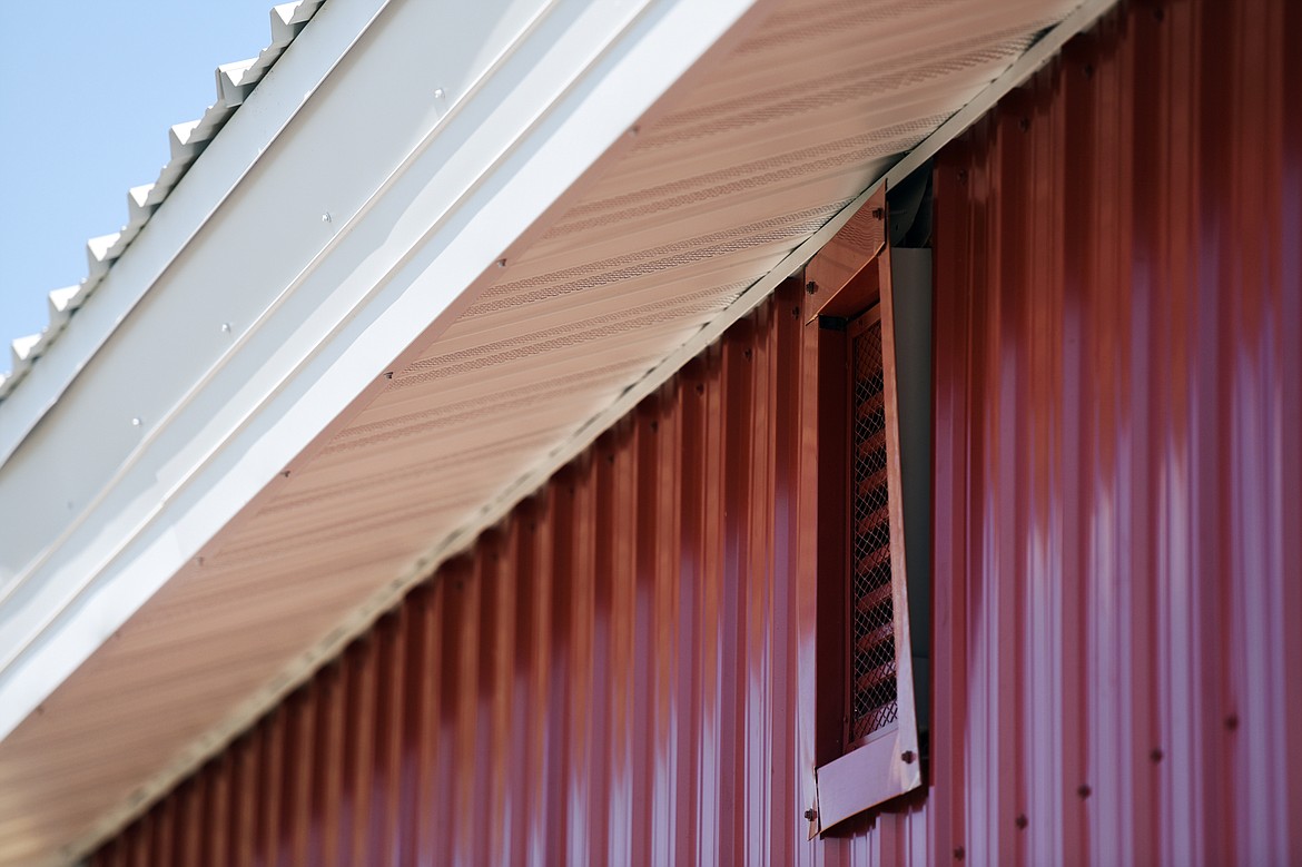 An exhaust vent has come loose from the exterior of the veterinary science building at the H.E. Robinson Vocational Agriculture Center in Kalispell on Wednesday, July 24. (Casey Kreider/Daily Inter Lake)
