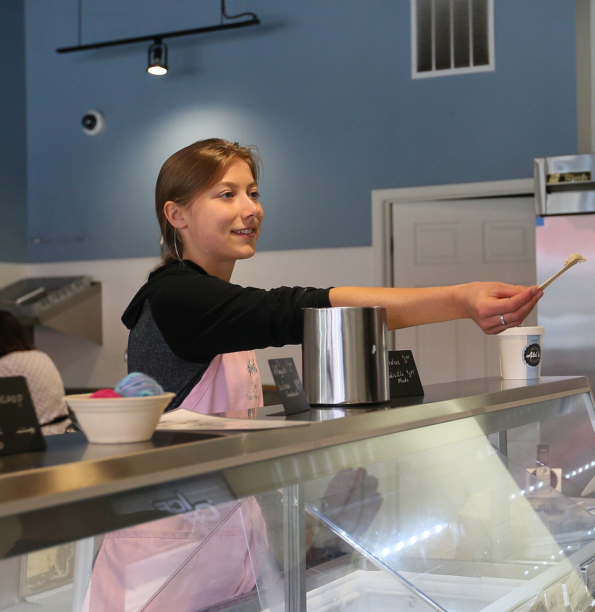 JULIA BENNETT/ Press 
Grace Meyer hands out ice cream samples recently at Abi&#146;s Ice Cream in downtown Coeur d&#146;Alene.