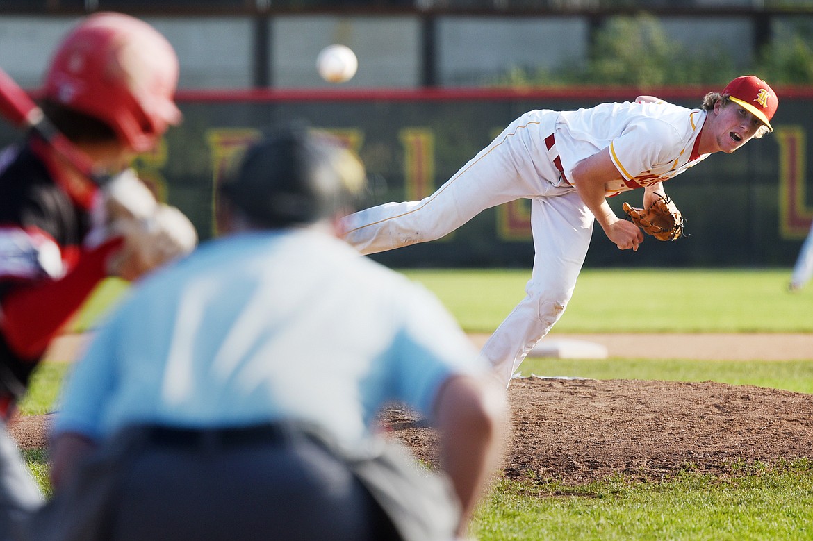 Kalispell Lakers AA starting pitcher Jack Corriveau follows through on a first-inning pitch against the Helena Senators AA at Griffin Field on Saturday. (Casey Kreider/Daily Inter Lake)