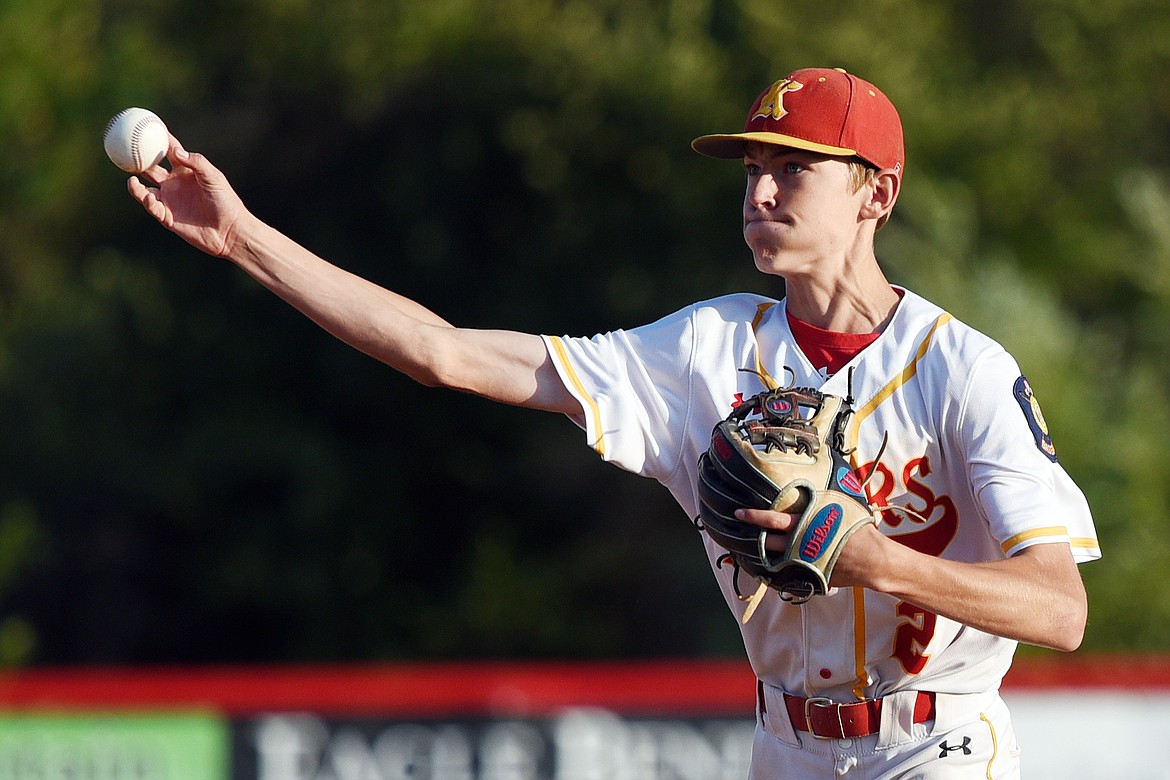 Kalispell Lakers AA second baseman Luke Halland fires to first after fielding a ground ball in the second inning against the Helena Senators AA at Griffin Field on Saturday. (Casey Kreider/Daily Inter Lake)