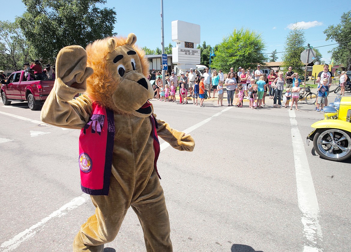 The Lions Club lion runs through the parade.